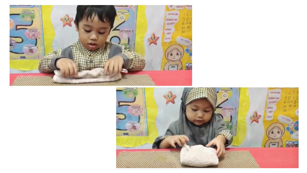 anak alumna melipat kain lap