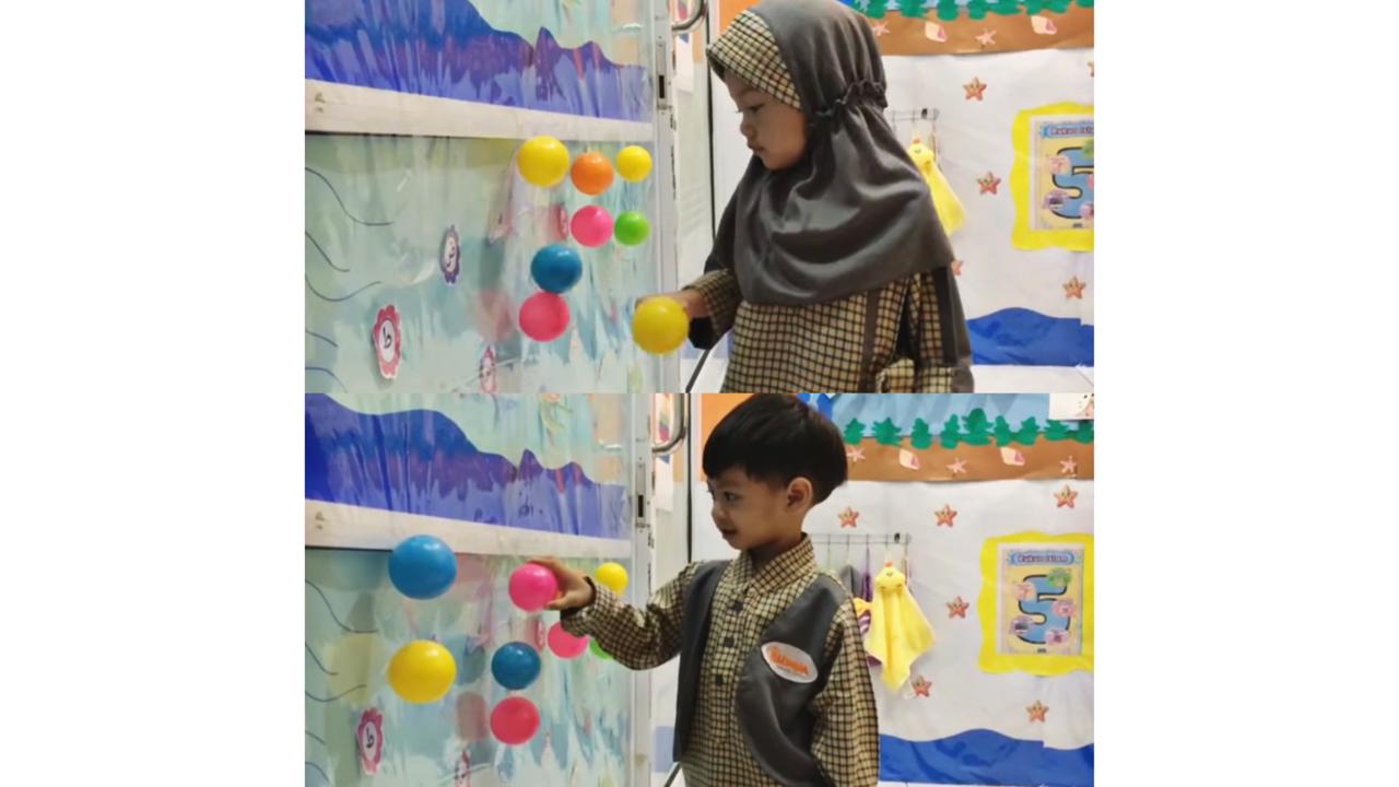 anak melepaskan bola yang menempel di dinding
