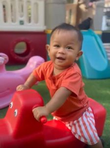 sunbathing baby alumna